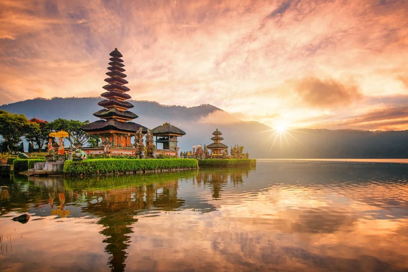 Bali's diverse landscapes include volcanic mountains, scenic beaches, and vibrant coral reefs, making it a popular destination for surfing, relaxation, and cultural experiences. Visitors flock to areas like Kuta for nightlife, Ubud for art and nature, and Seminyak for luxury.